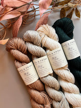 Load image into Gallery viewer, DK weight linen yarn in four colors - caramel, stone, white and dark green
