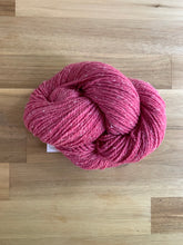 Load image into Gallery viewer, A skein of dark pink yarn called Peony.
