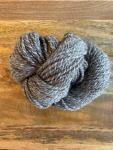 Load image into Gallery viewer, A skein of light gray and dark gray marled yarn.
