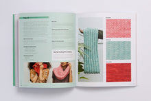 Load image into Gallery viewer, A book is open to show swatches of yarn fabric and partial photos of two people wearing red and pink cowls.
