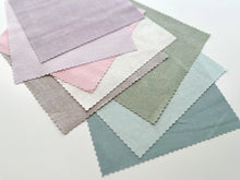 Load image into Gallery viewer, Eight fabric squares in pastel colors.
