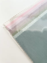 Load image into Gallery viewer, A clear sleeve holding 8 pastel linen-cotton fabrics.
