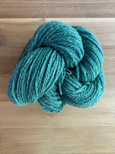 Load image into Gallery viewer, A skein of green yarn called Weathered Green.
