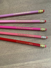 Load image into Gallery viewer, A set of five pencils in shades of pink and purple, with the words &quot;Reorganizing My Knits&quot; in gold lettering.
