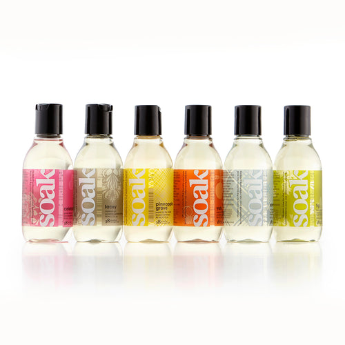 Six 3 oz bottles of Soak in scents Celebration, Lacey, Pineapple Grove, Yuzu, Scentless and Fig.