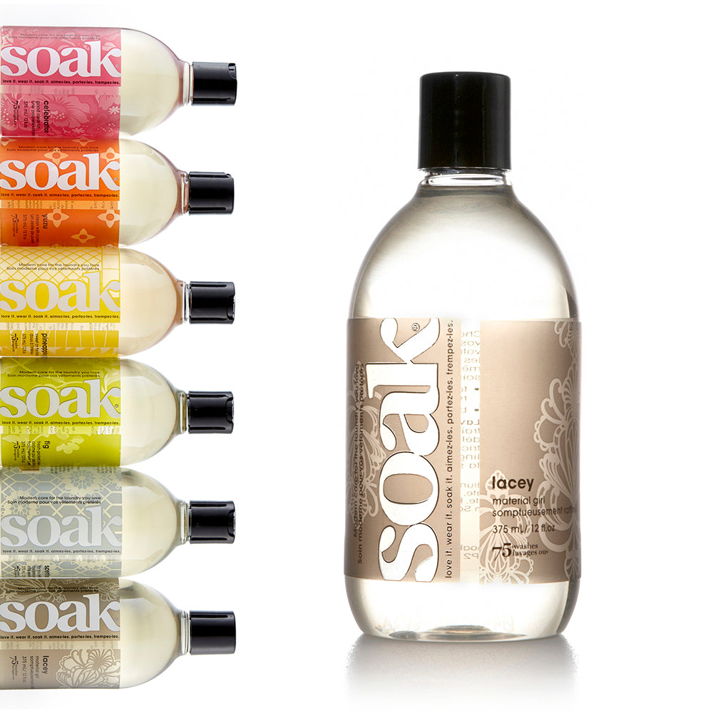 A 12 oz bottle of Soak, scent Lacey. The other scents are shown to the left.