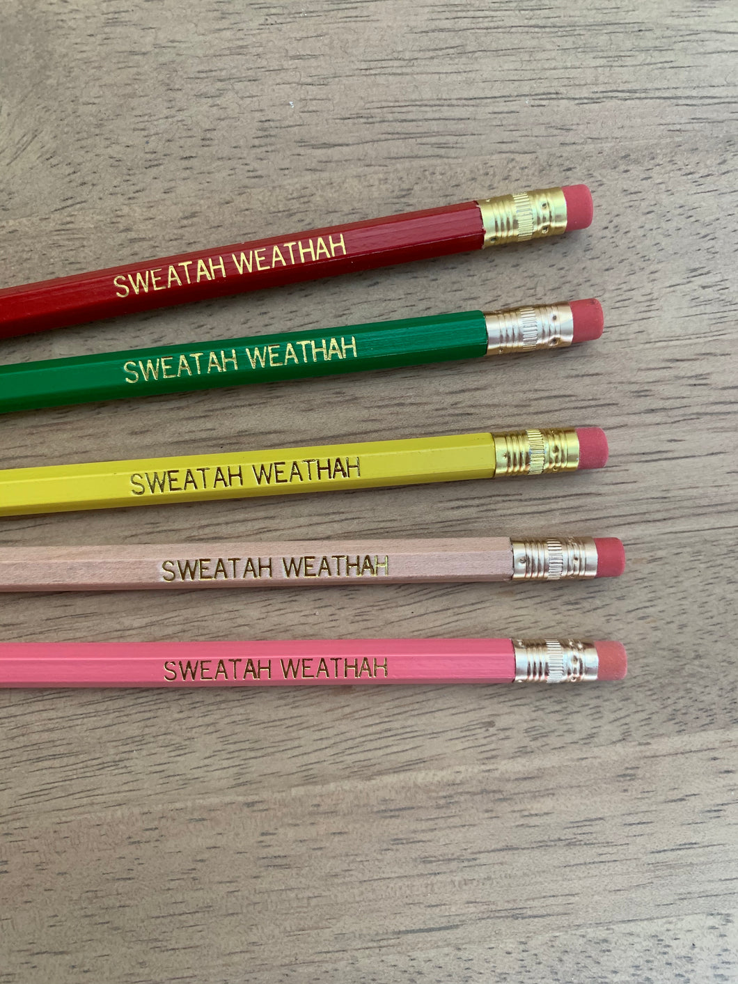 Five pencils in red, pink, natural, yellow and green, with 